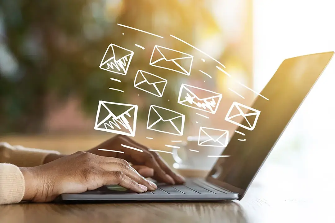 work email graphic with user on a laptop